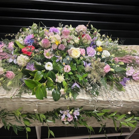 funeral-wicker-coffin-spray-and-garland