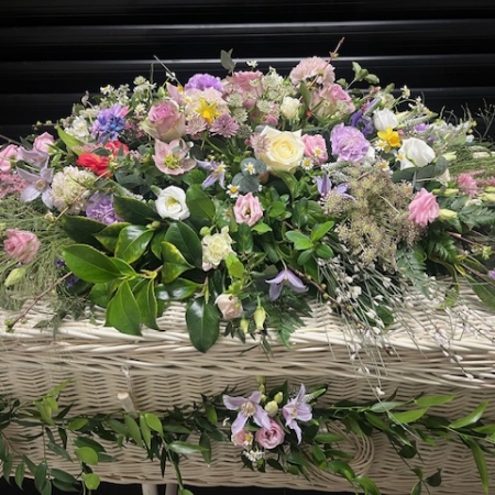 wicker-coffin-spray-and-garland